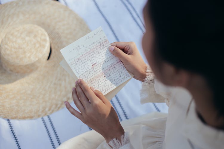 Overhead View Of Woman Reading Letter