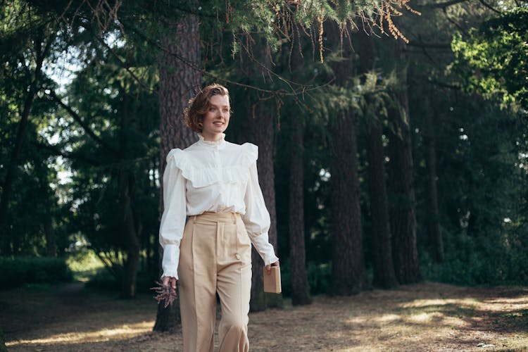 Smiling Woman Wearing Old-Fashioned Shirt Walking In Park