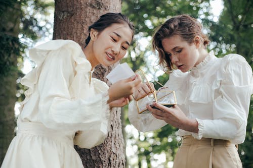 Two Women in 19th Century Outfits