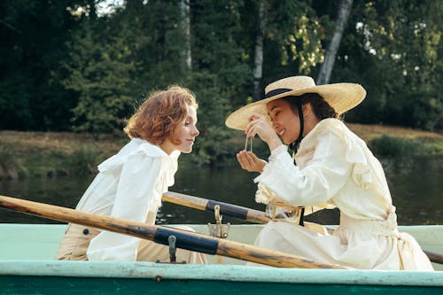 Two Women in 19th Century Outfit in Boat 