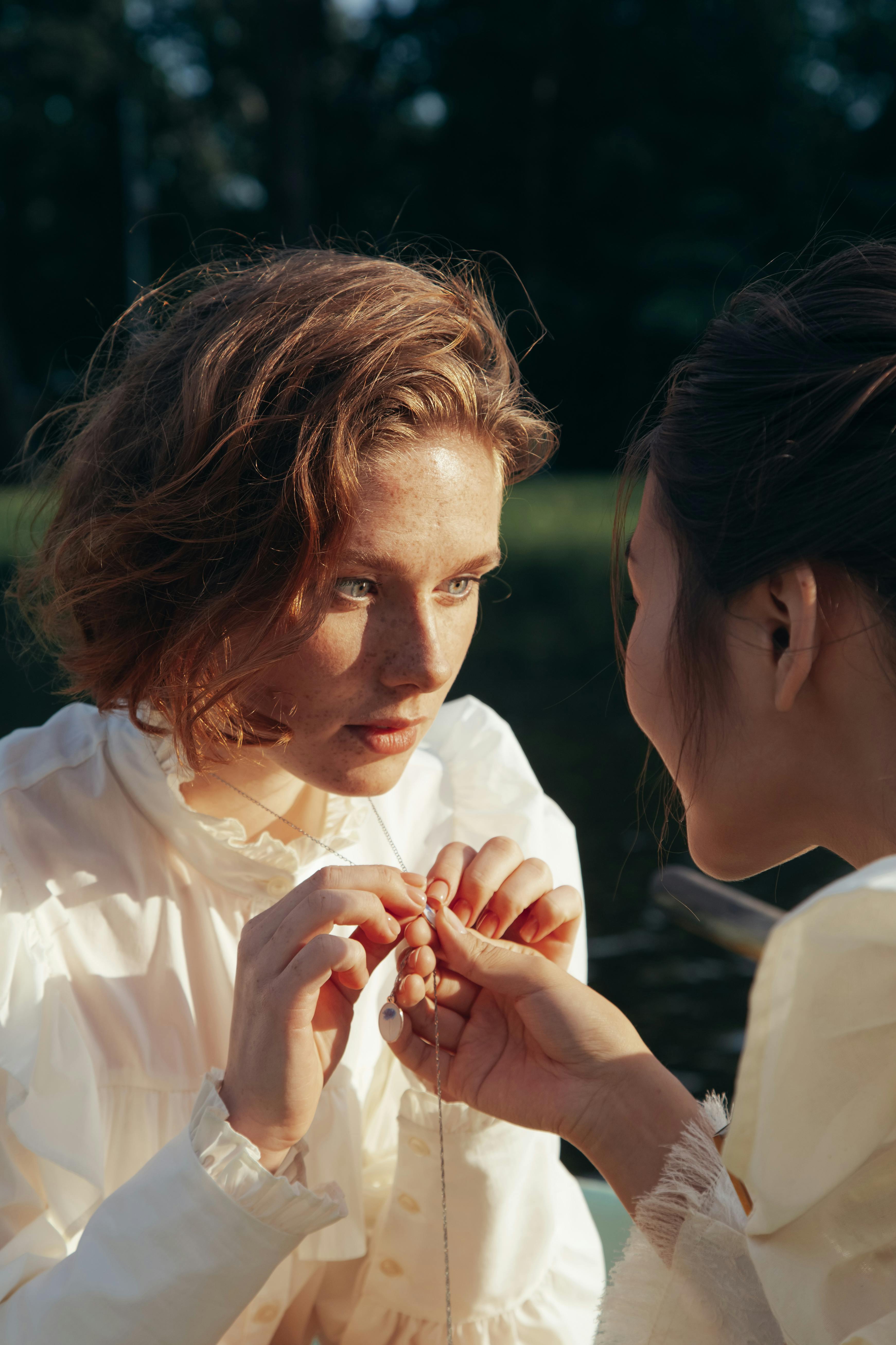 women holding a necklace