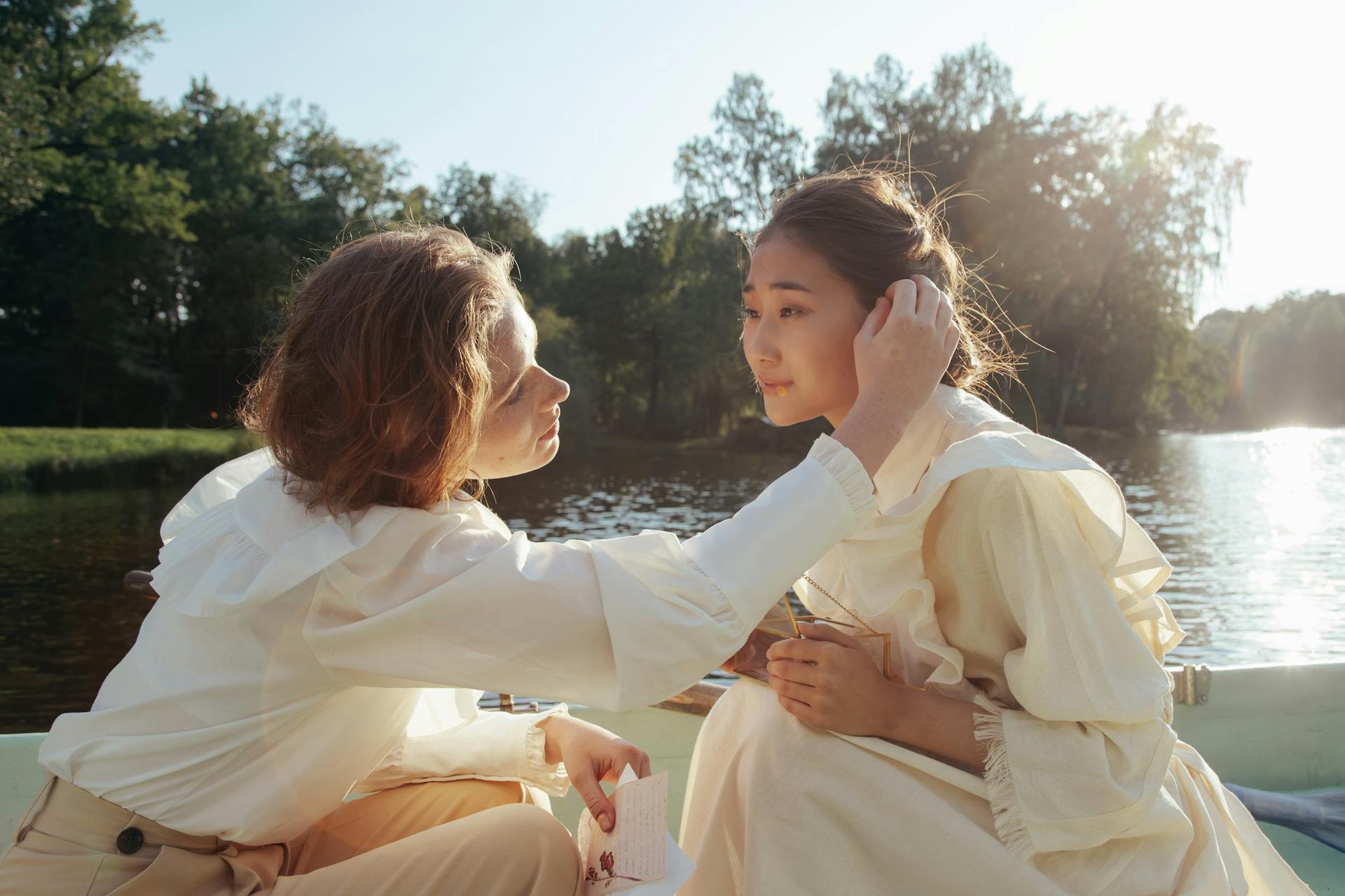 Woman Tucking the Person's Hair Behind the Ear