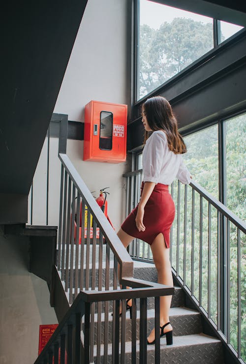 Photography of a Woman On Staircase