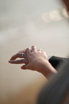A beautifully captured close-up of hands wearing rings, symbolizing love and commitment.