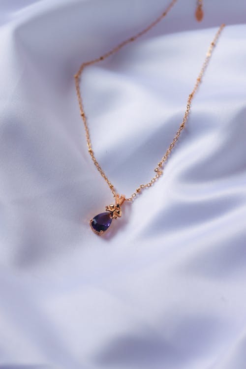 Gold Necklace With Purple Stone Pendant