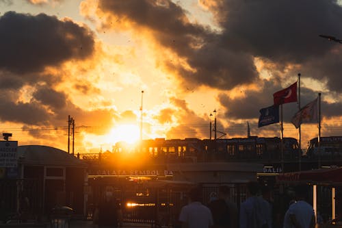 People Walking on the Street during Sunset