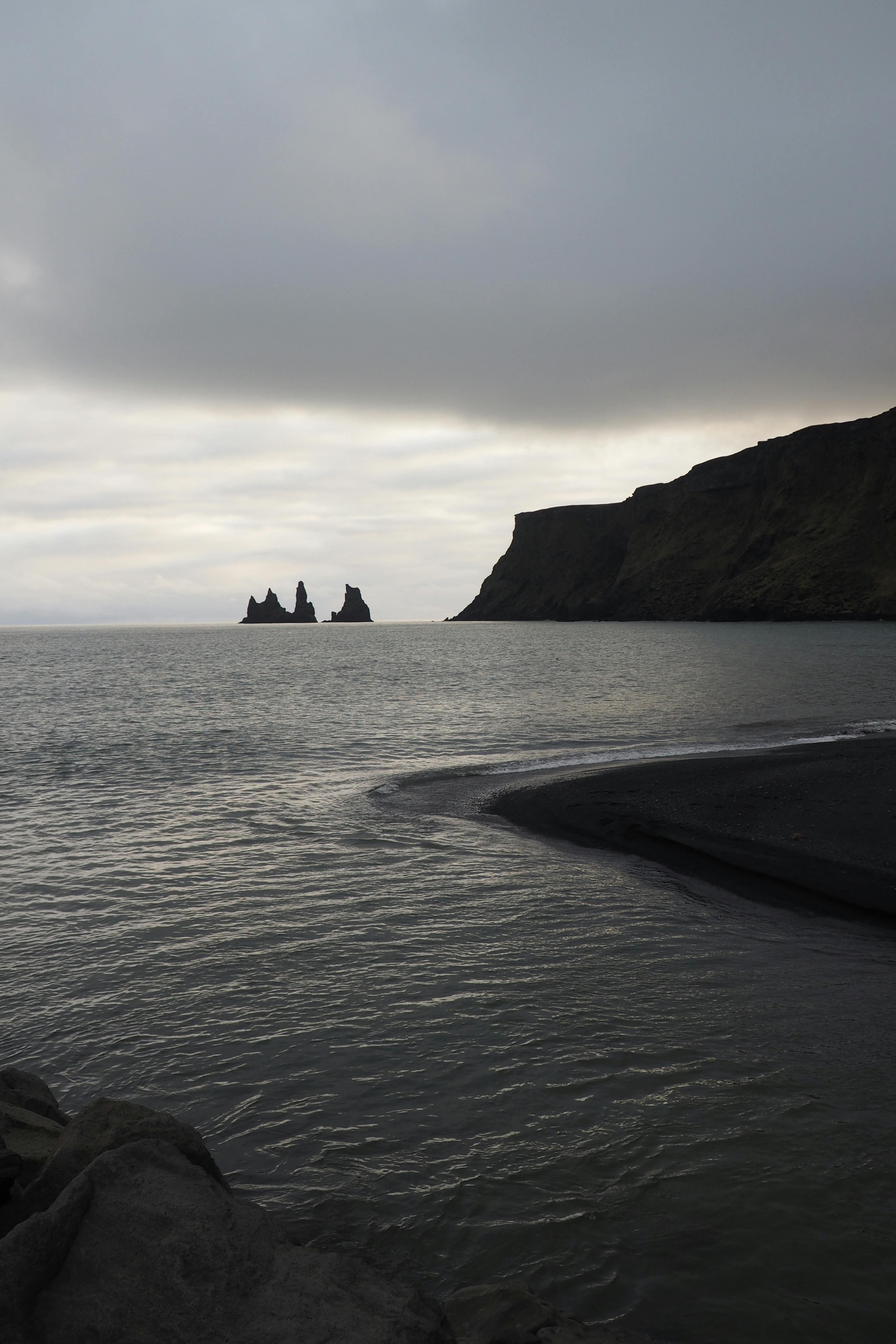 silhouette of a hill near the sea