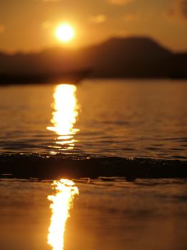 Capture of a serene sunset reflecting on Andaman's ocean waves, India.