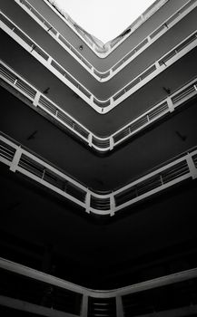Dramatic black and white view of a modern building in Dhaka, highlighting geometric design.