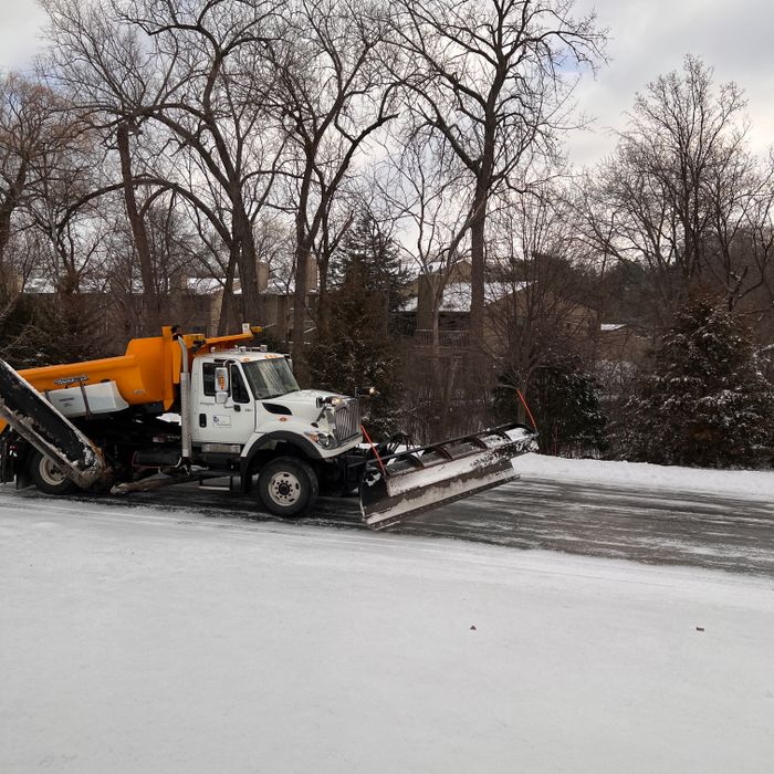 Plow truck clearing a residential street