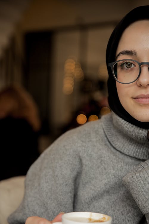 Woman in Gray Turtleneck Sweater Wearing Black Framed Eyeglasses