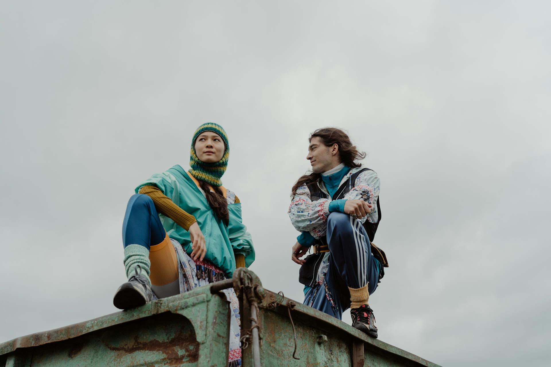 Man and Woman Raising Their Legs on  Truck Wagon