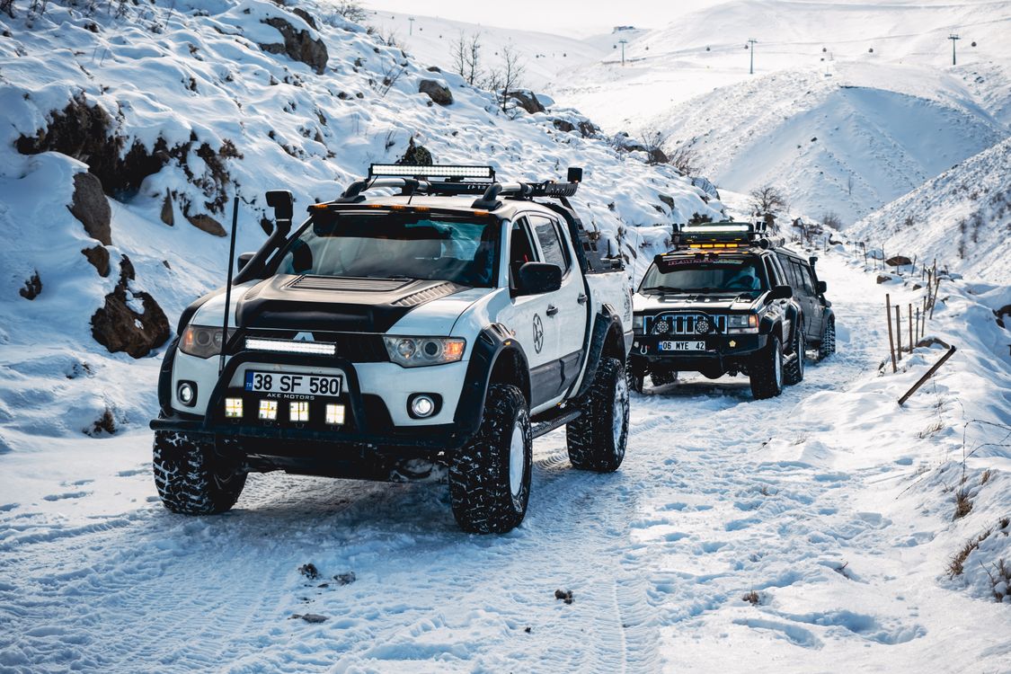 Vehicles on a Snow Covered Road · Free Stock Photo