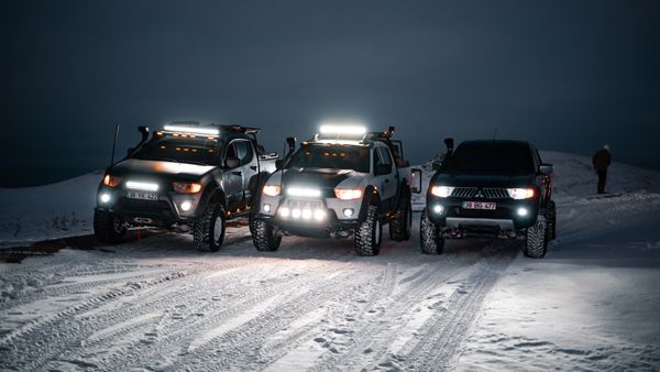 Off-road vehicle with auxiliary light bar at night