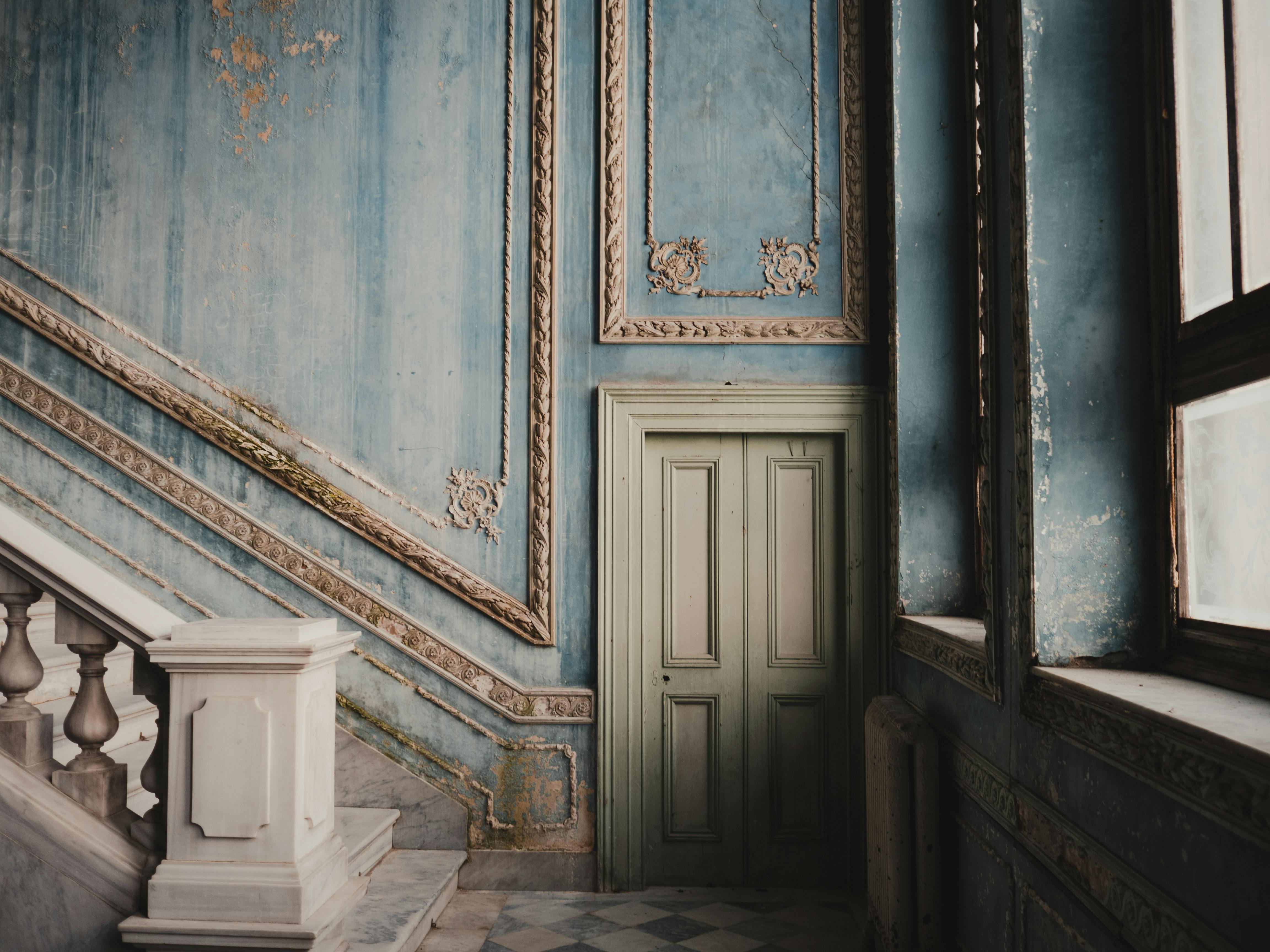 Vintage interior with ornate staircase and door in Istanbul, Türkiye.
