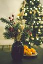 Green Glass Bottle With Yellow and Red Round Fruits