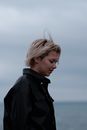 Woman in Black Leather Jacket Looking to Her Left