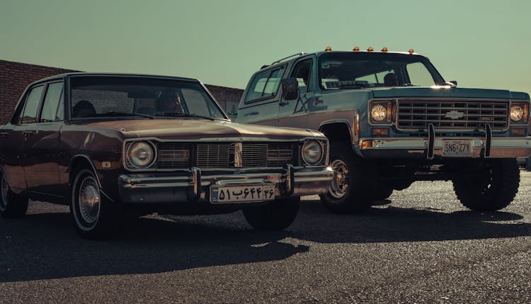 A Dodge Dart Beside A Chevrolet K5 Blazer