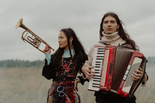 A Couple Holding Their Instruments