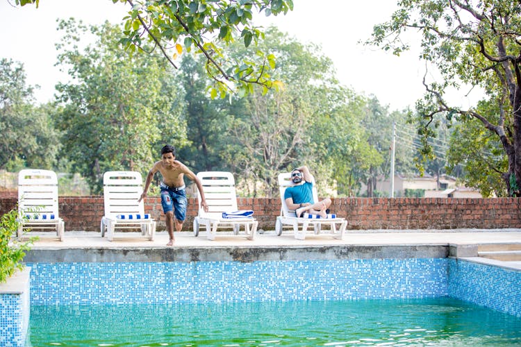 Man Jumping To Swimming Pool