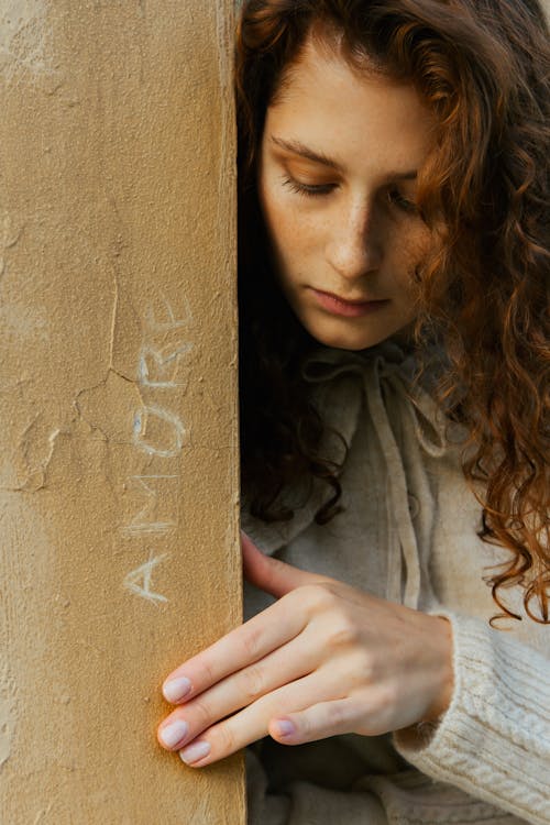 Close-up of Pensive Woman Standing by Column