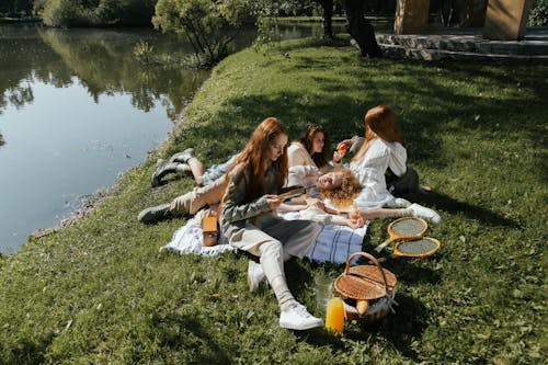 Women Relaxing by the Lake 