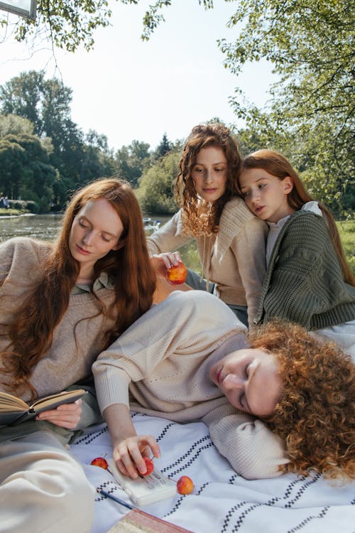 Four Women Relaxing in a Park 