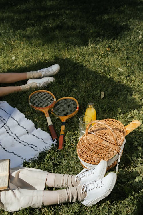 Free Picnic Basket and Tennis Rackets  Stock Photo