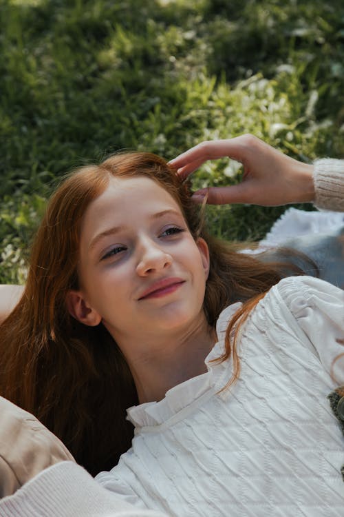 Portrait of a Young Woman Relaxing in a Park 