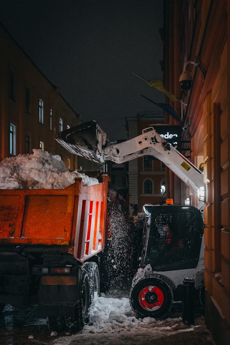 Municipal Services Cleaning Streets Of Snow At Night