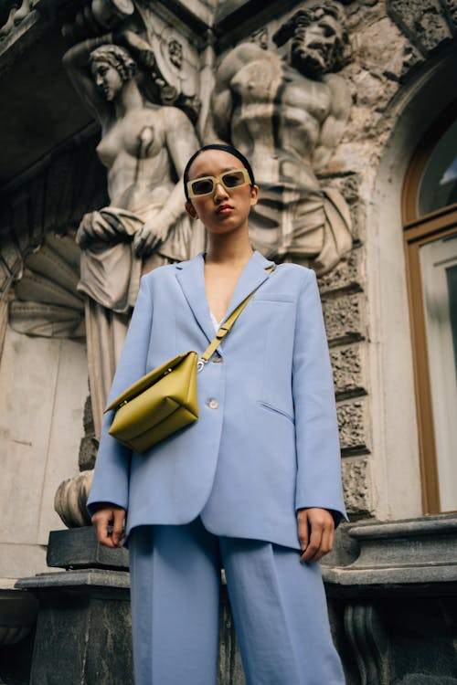 Woman in Purple Suit Wearing Sunglasses