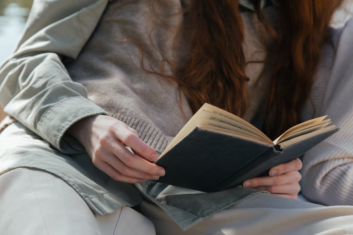 Free Woman Reading a Book Stock Photo