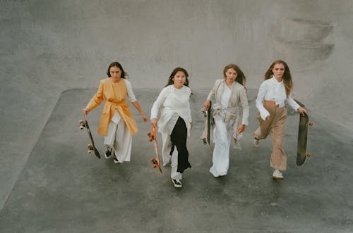 Ladies Holding Skateboard 