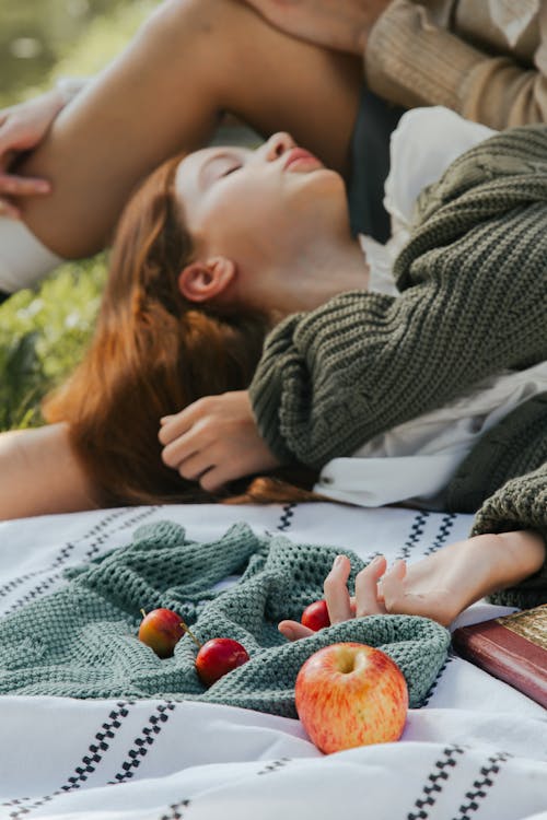 Woman Lying Down on Blanket with Fruit