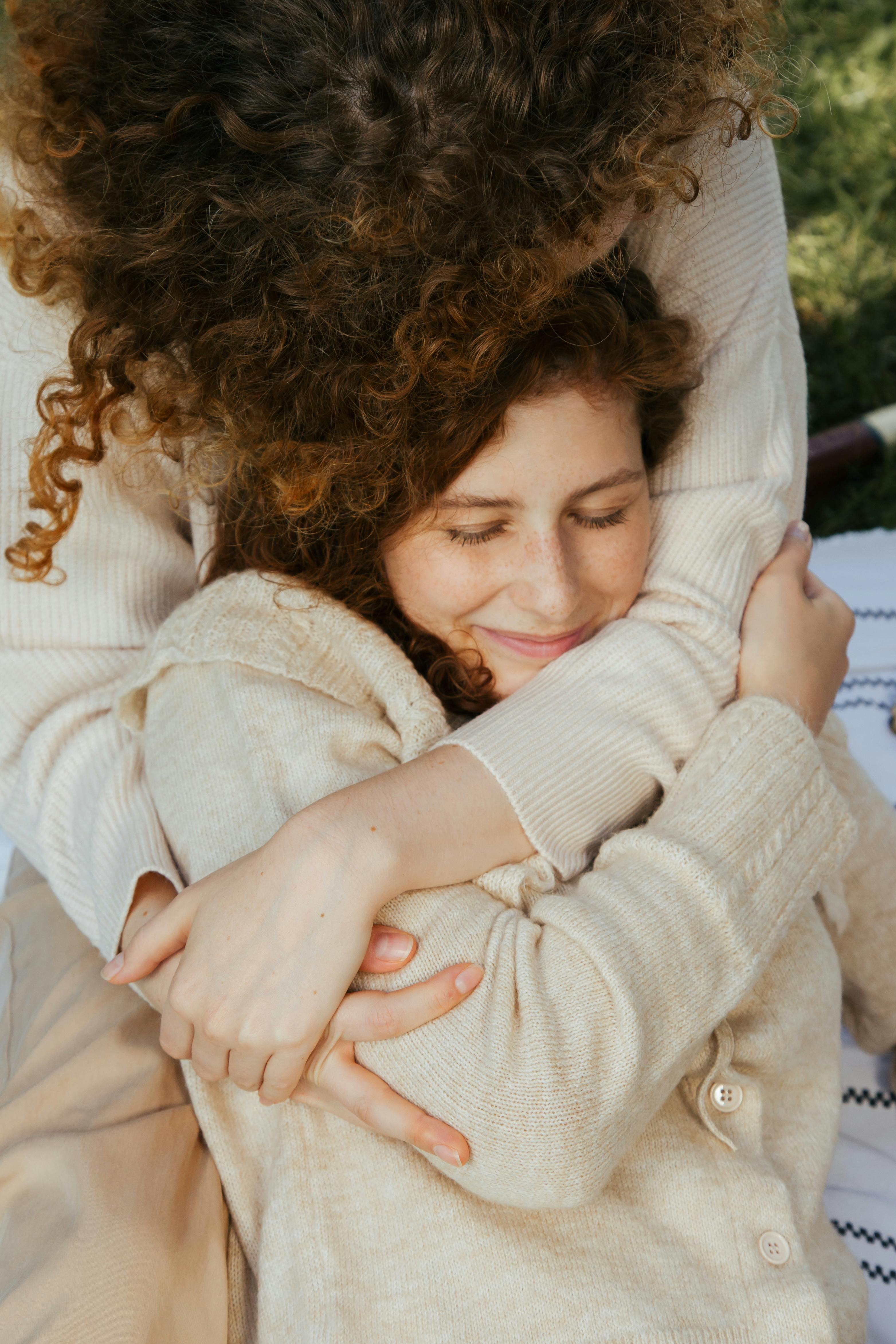 women hugging each other