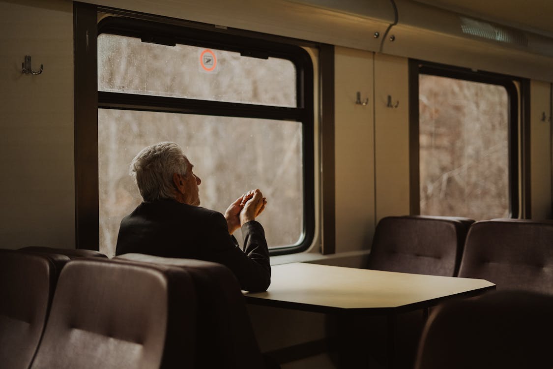 Man Sitting by Table