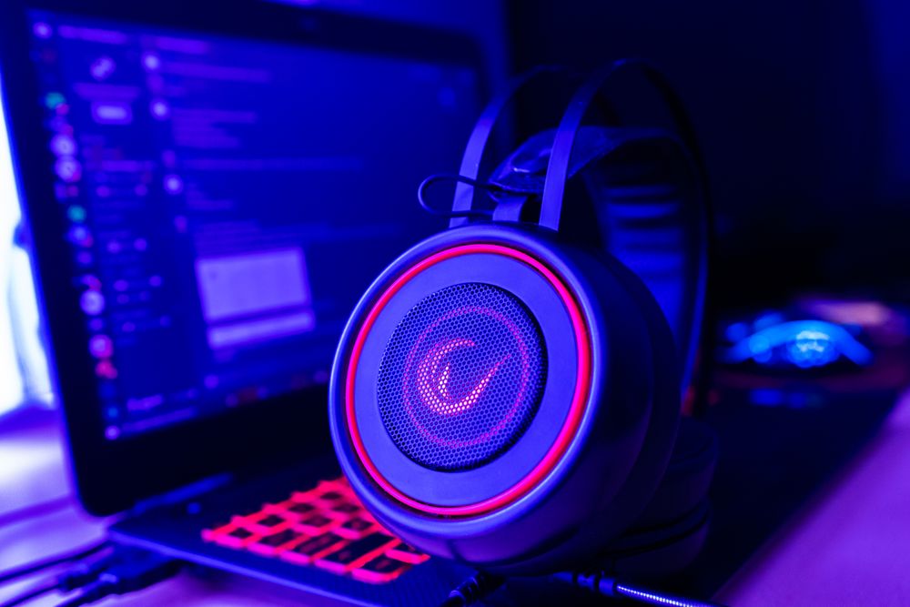 Premium gaming headset displayed beside a modern computer setup