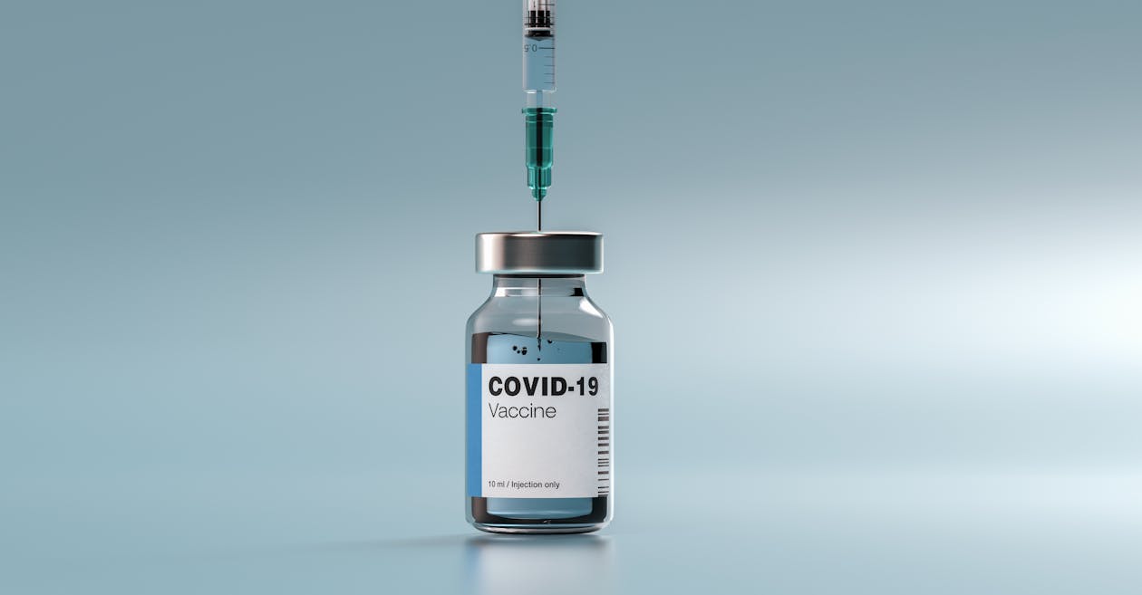 Syringe in a Vial of Vaccine