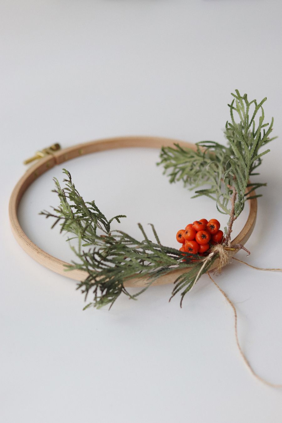 Evergreen Berry Hoop with red berries on green