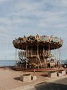 A Carousel Near the River Under Blue Sky
