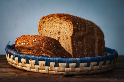 Free Brown Bread on Woven Basket Stock Photo