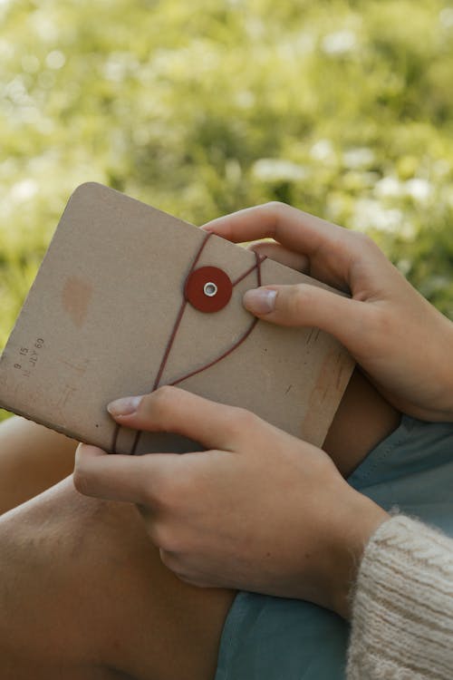 Woman Holding Journal 