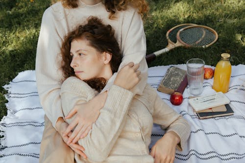 Women Hugging Each Other on Picnic 