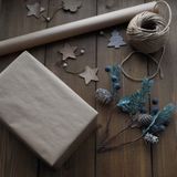 A parcel wrapped in paper and twine with paper stars, photo by Yliya Sitnikova on Pexels