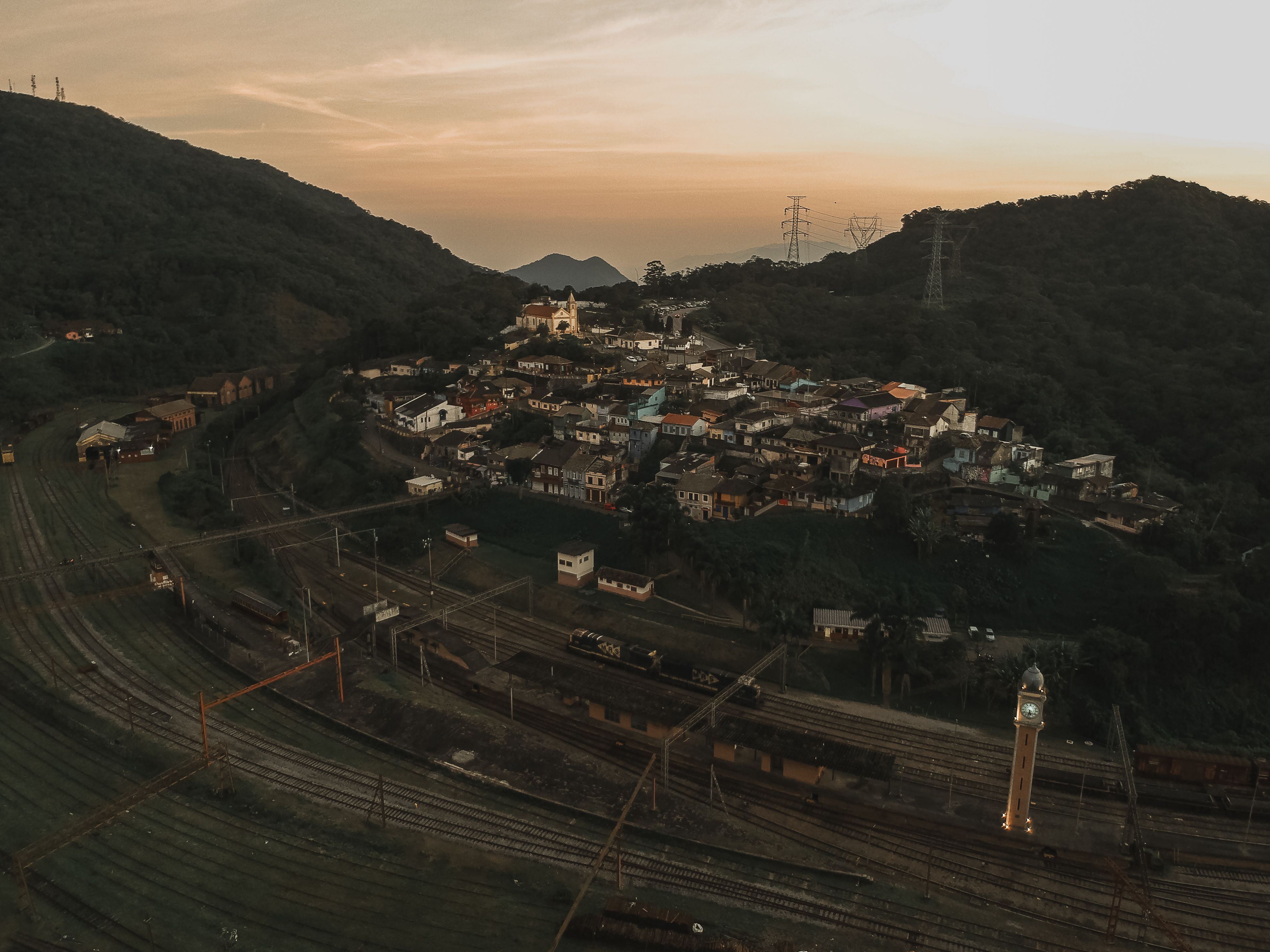Adobe houses and a small whitewashed church in a high Lenca village at dusk
