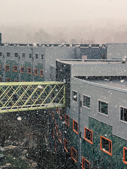 Free View of the Buildings During Snow Fall Stock Photo