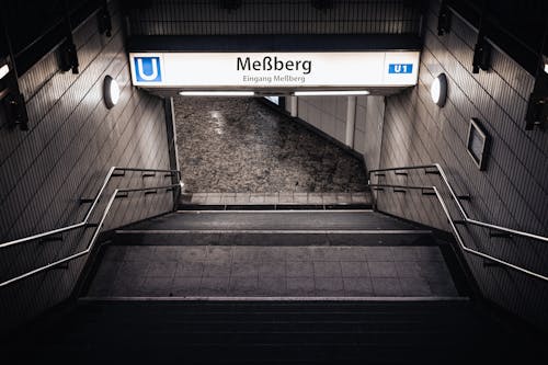 Black and White Stairs With Gray Metal Railings of a Subway