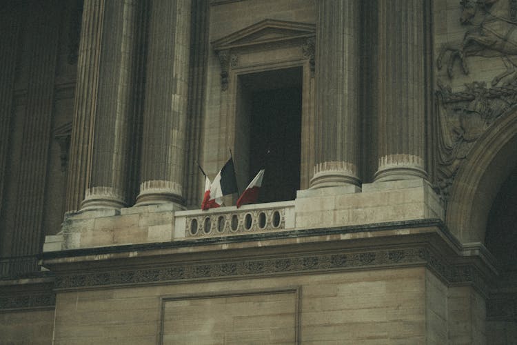 French Flags On Ornamented Building