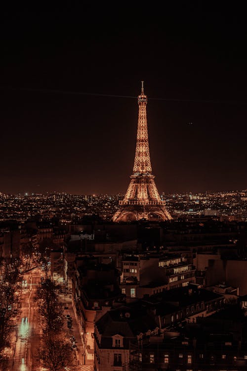 The Eiffel Tower in Paris Illuminated at Night in Paris, France · Free ...