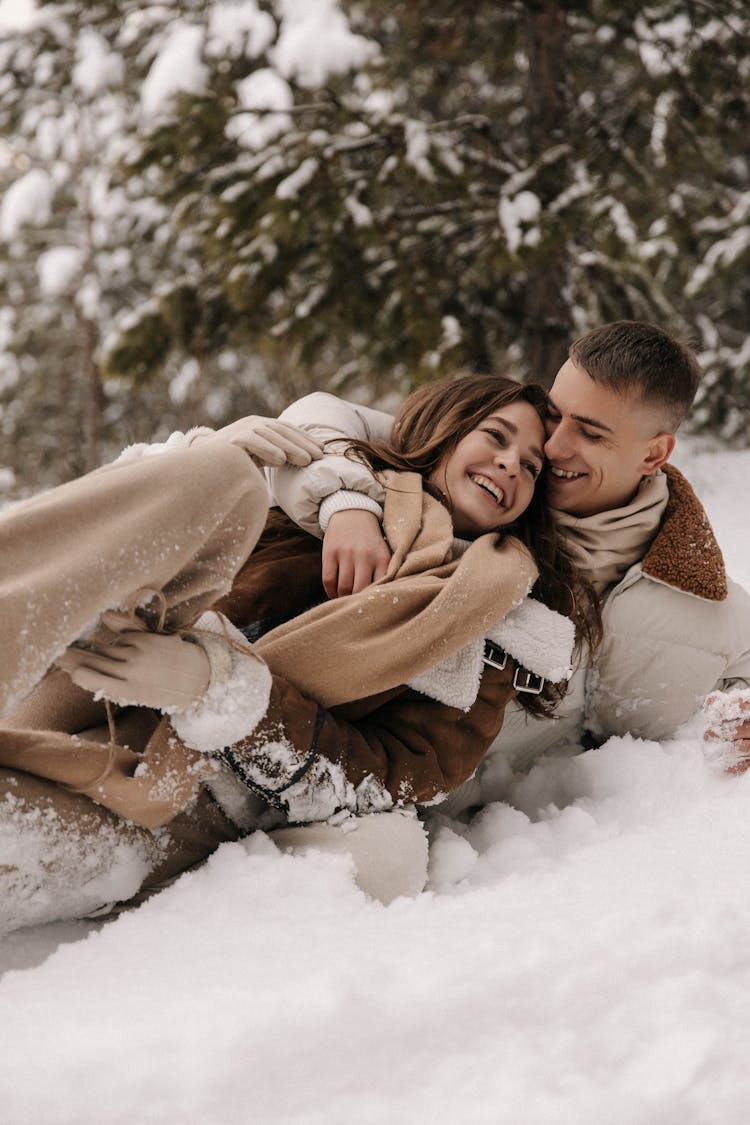 Couple Lying In Snow